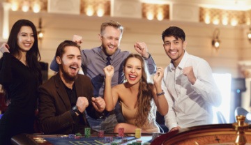 group of friends celebrating a casino win 