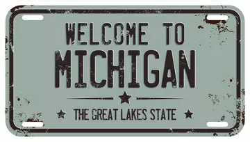 replica of a car license plate that says Welcome to Michigan