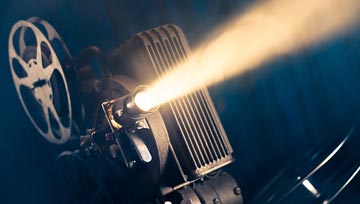 old fashioned movie projector and light