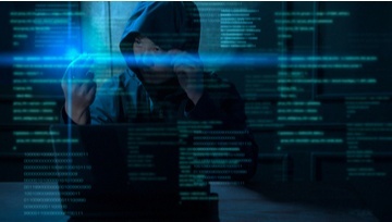 hacker image against background of digital data