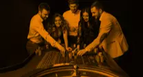 roulette table with people standing around