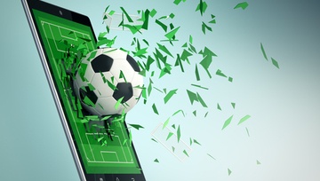 mobile phone screen with a soccer ball flying out of it