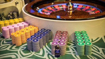 roulette wheel with piles of chips waiting for players