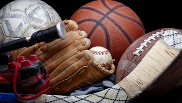 close up of sports equipment:  hockey, baseball, football, basketball
