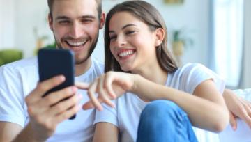 young couple watching online content